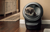 Cat using Litter-Robot 4 with fence