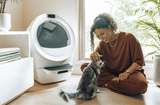 woman and cat with Litter-Robot 5 HSA/FSA Bundle