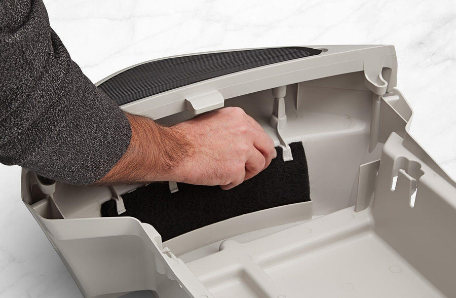Carbon filter being installed into a Litter Robot Drawer