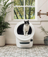 white Litter-Robot EVO with tuxedo cat inside
