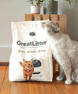 GreatLitter premium clumping cat litter and cat rubbing on the packaging